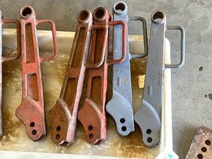 lot 19 image: Assorted Ditch Witch Linkage Parts, Planer Parts, Etc
