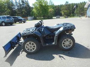 lot 3 image: 2014 Polaris Sportsman 550 with Plow