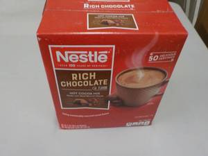 lot 12 image: 1 Box of 50 - .71 oz. packets Nestl...