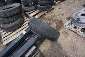 lot 46 image: Savers HT2 Truck Tire and 8 Bolt Dually Rim