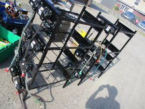 lot 23 image: 8 pc. Soda Dispener Racks With Flo...