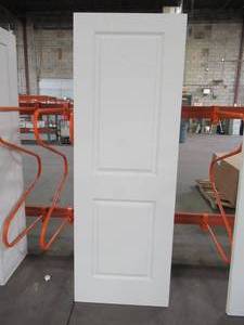 lot 612 image: Jeld-wen 28 x 80 Cambridge Primed Smooth Molded Composite MDF Interior Door Slab.