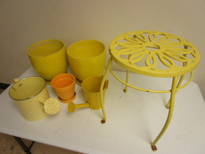 lot 330 image: YELLOW GARDEN DECOR, DECORATIVE TABLE, WATERING CANS, PLANT POTS