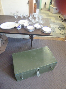 Chest with Set of Dishes and Wine Glasses