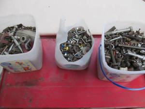 Jugs full of nuts, bolts, etc