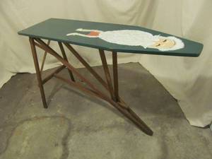 vintage ironing board with painted santa