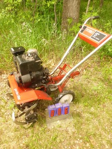 lot 6 image: Toro 5 hp Roto tiller. Nice condition. Tested & works. As shown.