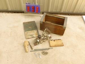 lot 38 image: Vintage Stanley # 45 wood plane with blades & accessories. In antique box. Nice shape. As shown.