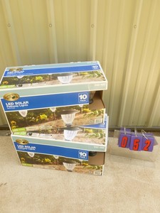 lot 52 image: 2 boxes of 10 led solar lights. As shown.