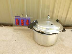 lot 54 image: Large mirro pressure cooker with valve. As shown.