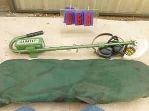 lot 58 image: Garrett metal detector with headphones. High quality unit. Tested & works. As shown.