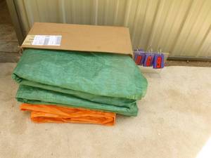 lot 69 image: Box of tarps. Used very little. As shown.