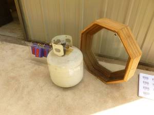 lot 81 image: Propane tank & opening octagon window. As shown.