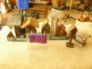 lot 108 image: Qty of 5 Bird houses & 2 bird feeders. As shown.