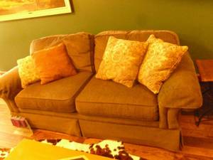 lot 131 image: 88 long clean fabric couch & pillows. Very clean. As shown.