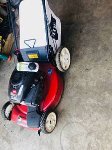 Toro 22 in. Kohler Low Wheel Variable Speed Gas Walk Behind Self Propelled Lawn Mower in working conditions