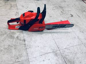 ECHO 14 in. 30.5 cc Gas 2-Stroke Cycle Chainsaw in working conditions