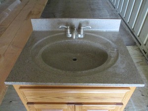 lot 35 image: VANITY AND MARBLE SINK TOP W FAUCETS