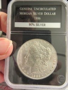lot 111 image: UNCIRCULATED 1886 MORGAN SILVER DOLLAR
