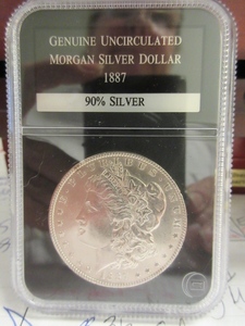 lot 112 image: UNCIRCULATED 1887 MORGAN SILVER DOLLAR