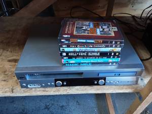 lot 25 image: JVC DVDVHS Player With 8-DVDs