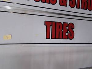 lot 212 image: Metal Tire Sign