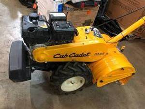 lot 211 image: Cub Cadet 18 in. 208cc Rear-Tine Dual-Direction Gas Tiller Missing parts for fully tested Motor starts .as-is