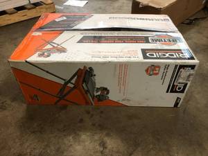 lot 103 image: RIDGID 9 Amp Corded 7 in. Wet Tile Saw with Stand in good condition
