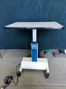 POWERED HEIGHT ADJUSTABLE MOBILE SIT TO STAND WORKTABLE - LIGHT WEIGHT ENOUGH TO TAKE ALL OVER YET POWERFUL SIT TO STAND DESK - EXCELLENT WORKING CONDITION - YES I DO WANT THIS