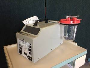 Precision Medical PM65HG Easy Go Vacuum Pump Aspirator -&nbspFeatures a float-shut-off suction canister with an inline Hydrophobic Filter - prevents any back-flow of fluid from entering the machine- Great Working Condition