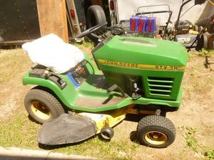 1996 John Deere STX38. Tested & works. May need carb adjustment for high speed. Seat is cracked. Very nice hood. May also need battery. As shown.