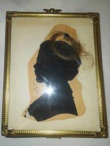 lot 42 image: 1934 silhouette with lock of hair framed.