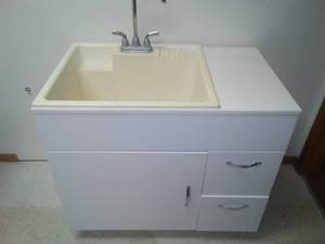 lot 22 image: Deep, basin scrub sink utility laundry.
