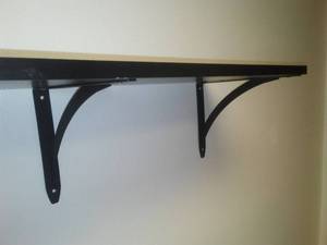 lot 25 image: 2 shelves with metal brackets