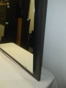 lot 81 image: Floating 42.75 mirror on black frame- nice, 43.5 x 27.75