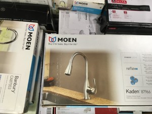 lot 14 image: Pallet with assorted Branded Faucets Customer return open boxes some items have been used