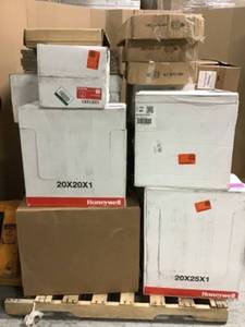 lot 61 image: Pallet with assorted cases of furnace filters mostly are new