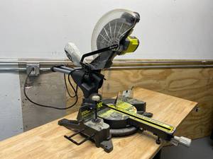 lot 81 image: RYOBI TSS120L 15 Amp 12 Slide Miter Saw