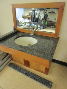 lot 817 image: BATHROOM VANITY, WITH KOHLER SINK, MARBLE COUNTER TOP. WOOD CABINET, WALL MIRROR