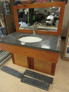 lot 818 image: BATHROOM VANITY, WITH KOHLER SINK, MARBLE COUNTER TOP. WOOD CABINET, WALL MIRROR