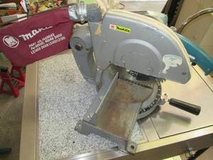 lot 166 image: Makita 255 Miter Saw Model# 2401B...