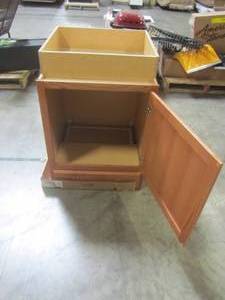 lot 209 image: Hampton Bay Assembled 24x34.5x24 in. Base Kitchen Cabinet with Ball-Bearing Drawer Glides in Medium Oak KB24-MO