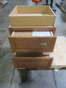 lot 210 image: Hampton Bay Assembled 24x34.5x24 in. Drawer Base Kitchen Cabinet with Ball-Bearing Drawer Glides in Medium Oak KDB24-MO