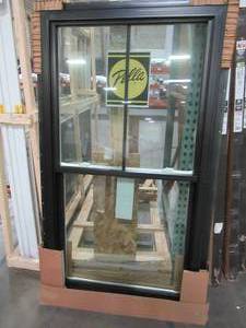 lot 618 image: PELLA 350 Series Black Vinyl ExteriorWhite Interior DOuble Hung Window With Tilting Sashes.