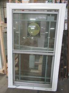 lot 619 image: PELLA Double Hung Window In White Vinyl, Fin Install. Dual Grill 6-lite Sashes. - 1 Sash is dented and will not closelock.