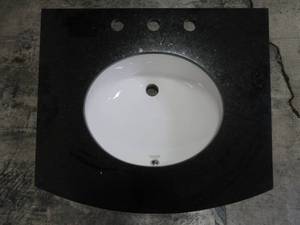 lot 105 image: Black GraniteStone Vanity Top with Curved Front, 25 X 22 With 8 Faucet Spread.