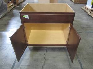 lot 119 image: Hampton Assembled 36x34.5x24 in. Sink Base Kitchen Cabinet in Cognac KSB36-COG