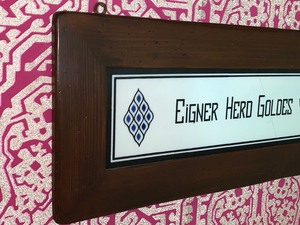 lot 18 image: German Framed Sign- Eigner Herd Goldes Wert