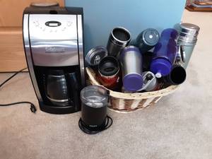 lot 60 image: Cuisinart Coffee Maker, Coffee Bean Grinder & Basket Of Travel Mugs