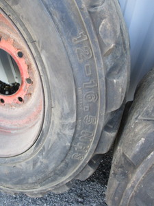 lot 101 image: Bobcat Skidloader Tires and Wheels